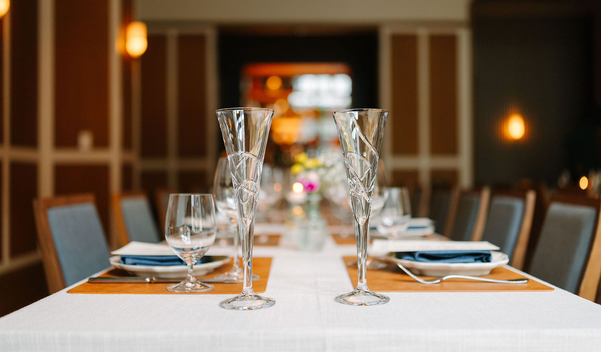 Modern wedding ceremony space with elegant floral arrangements.