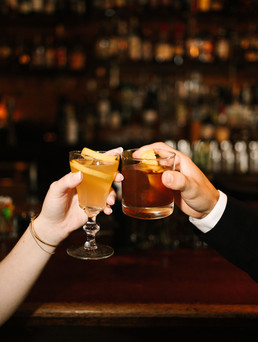 Close up of craft cocktails during Detroit bar engagement session
