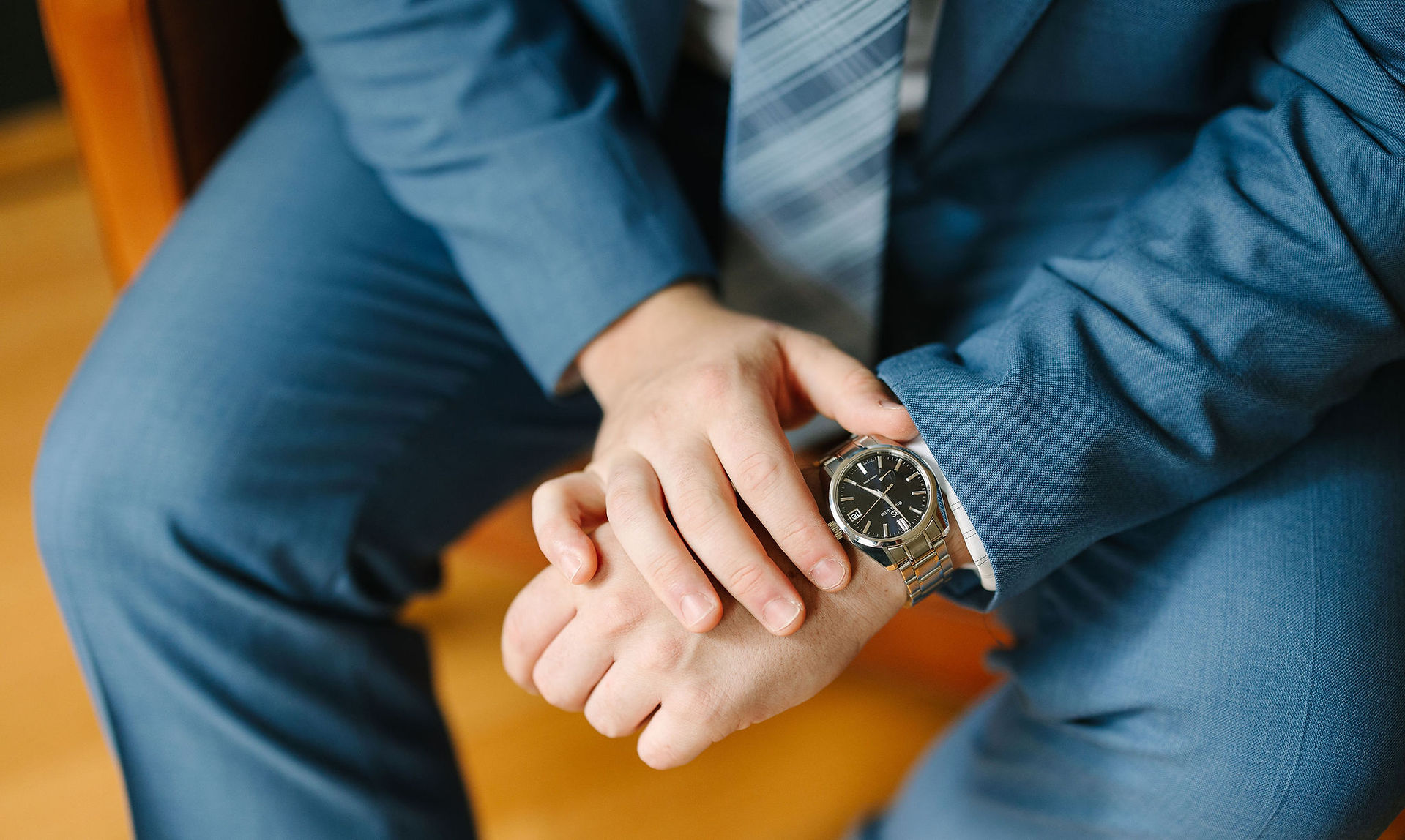 Couple getting ready in their Shinola Hotel suite before their micro wedding.