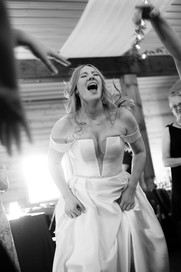 Guests celebrating on the dance floor at Creekside Acres Event Barn in Goodrich, MI.