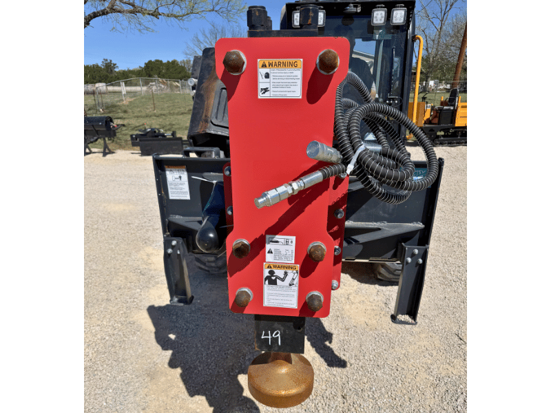 red raytree post driver skid steer attachment