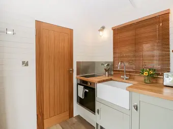 shepherd hut kitchen and living space with modern features
