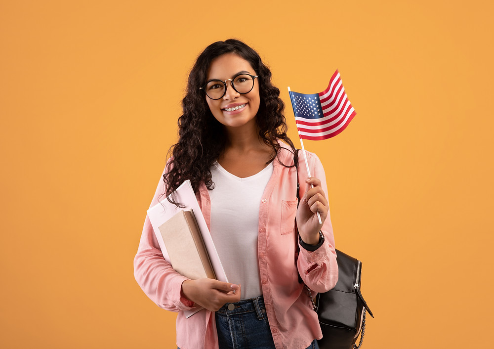 Student with books and an American flag