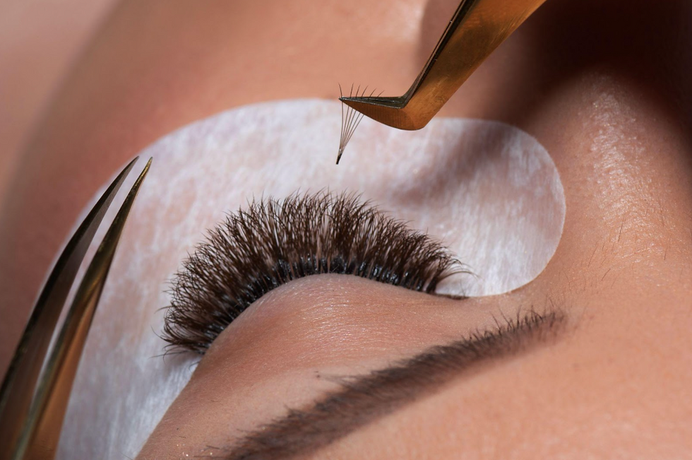 Eyelash extensions being applied