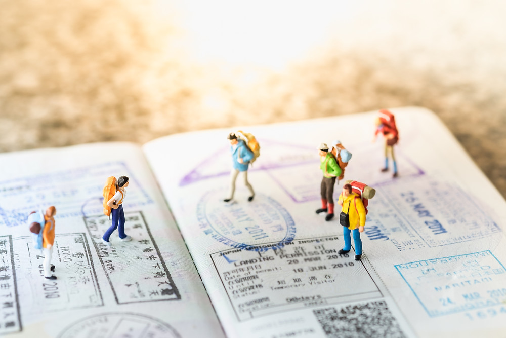 Travelers with backpacks on a passport