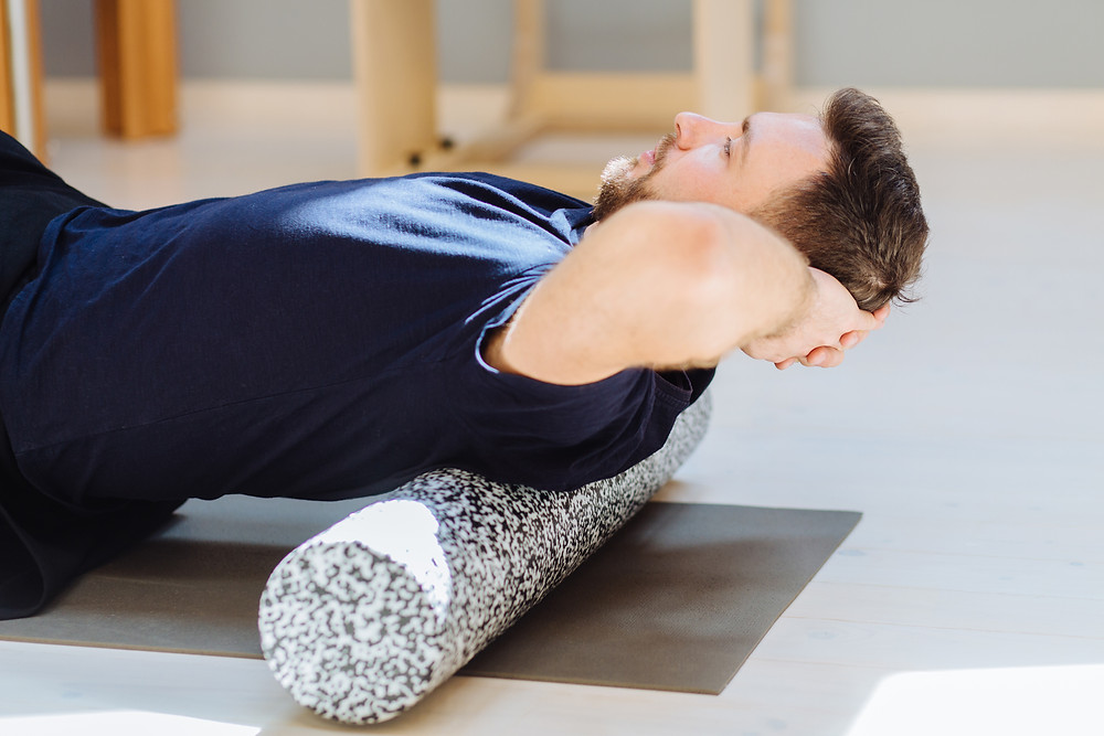 Man using a foam roller