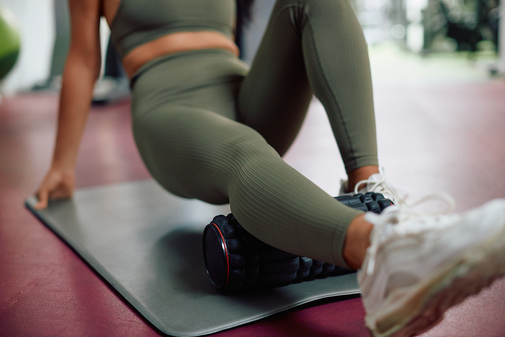 Woman foam rolling