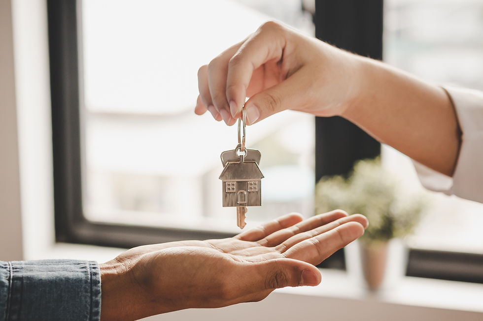 Model house with keys symbolizing buying and renting property