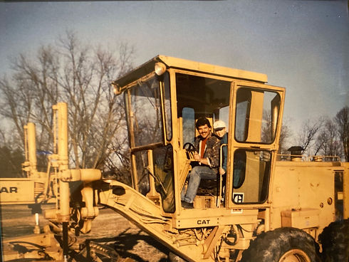 Micah and dad - tractor.jpeg