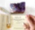 Amethyst crystal cluster, pearl beaded bracelet, and journal flatlay for Gem Jewelry’s Crystals 101 section