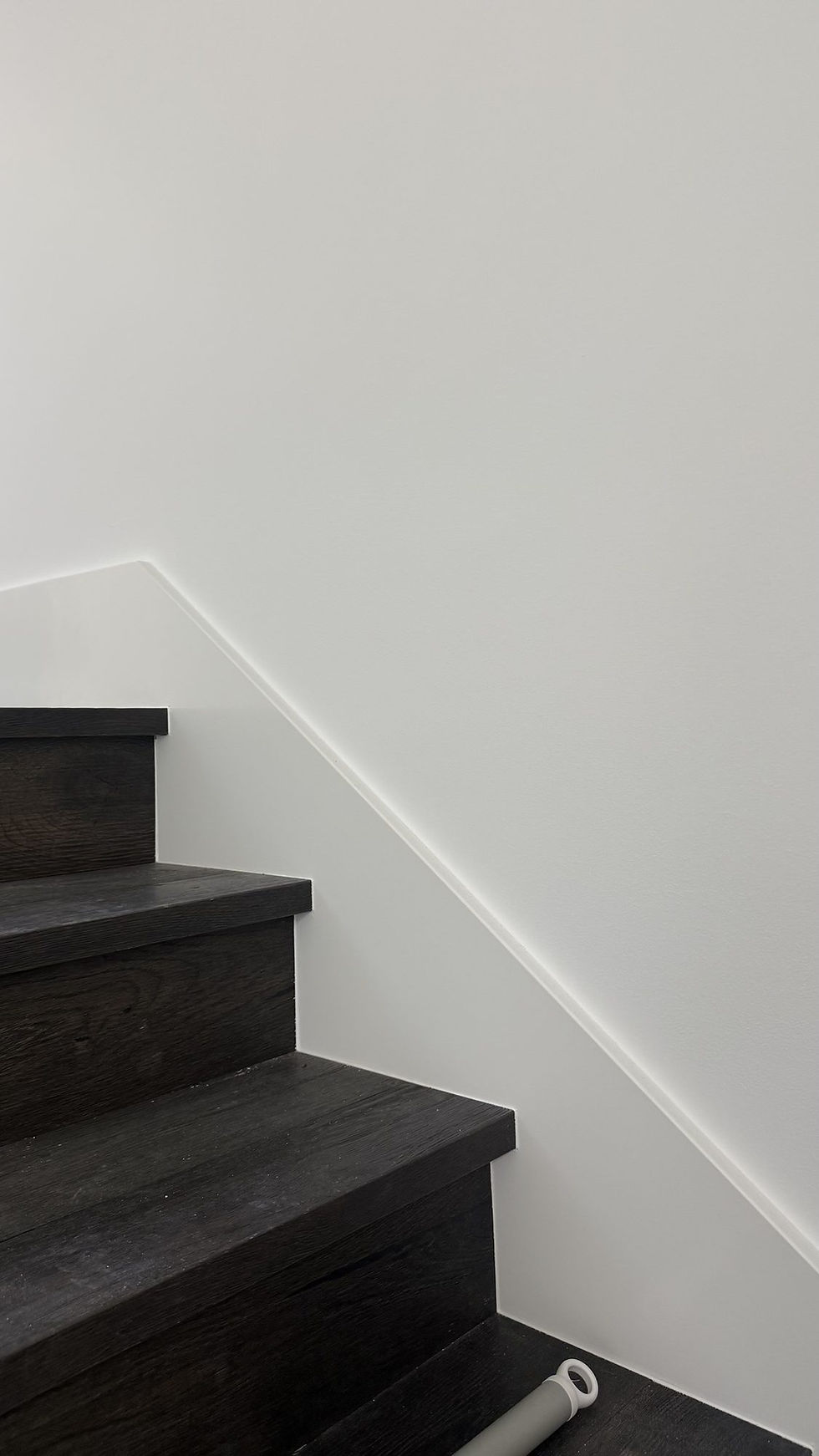 The stair wall, finished to Level 5