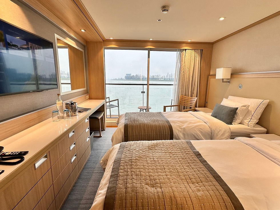 Beds split to two twins aboard a Viking Longship Category A Veranda Cabin