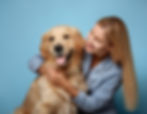 A Woman Joyfully Embracing Her Golden Retriever