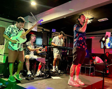 Band performing live on stage at Elevate Lounge in Ajax, Durham.