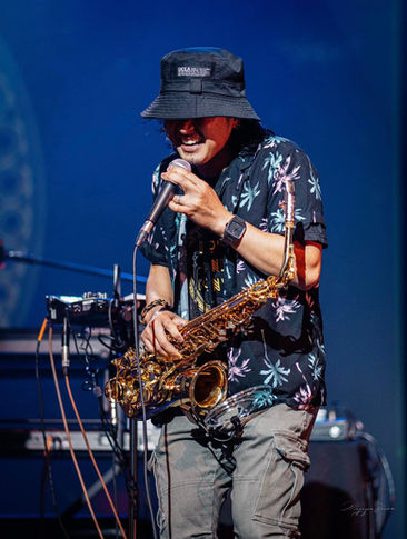 Saxophonist performing live on stage