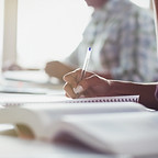 Person Writing Notes