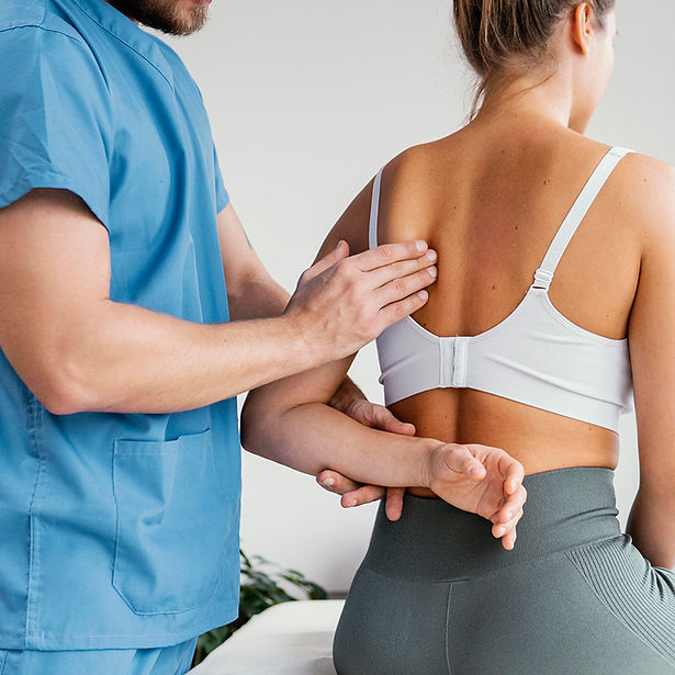 side-view-male-osteopathic-therapist-checking-female-patient-s-scapula-bone.jpg