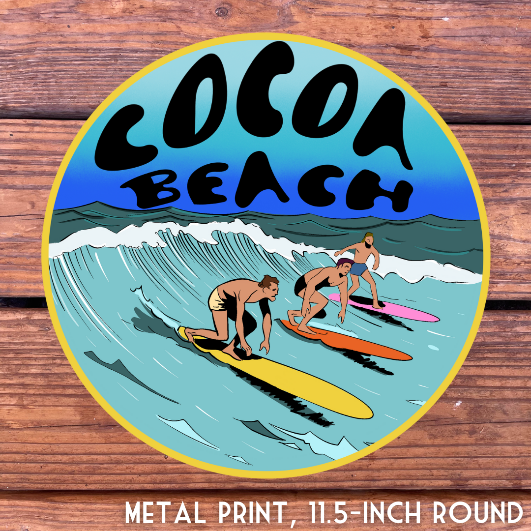 Cocoa Beach metal print with surfers riding waves, 11.5-inch round.