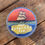 Thumbnail: Round sticker with a ship and text: The Sargasso Sea. Bongoland Sticker.