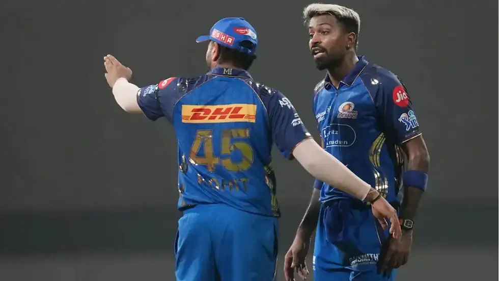Rohit Sharma (45) and MI captain Hardik Pandya (R) have a conversation on the field. (Photo: AP)