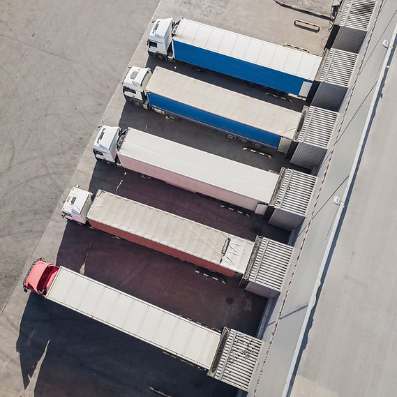 aerial-view-trucks-unloading-logostics-center.jpg