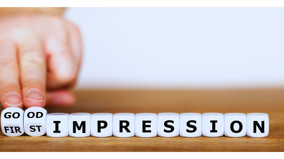 First impressions matter concept with hand arranging cubes showing text on wooden table