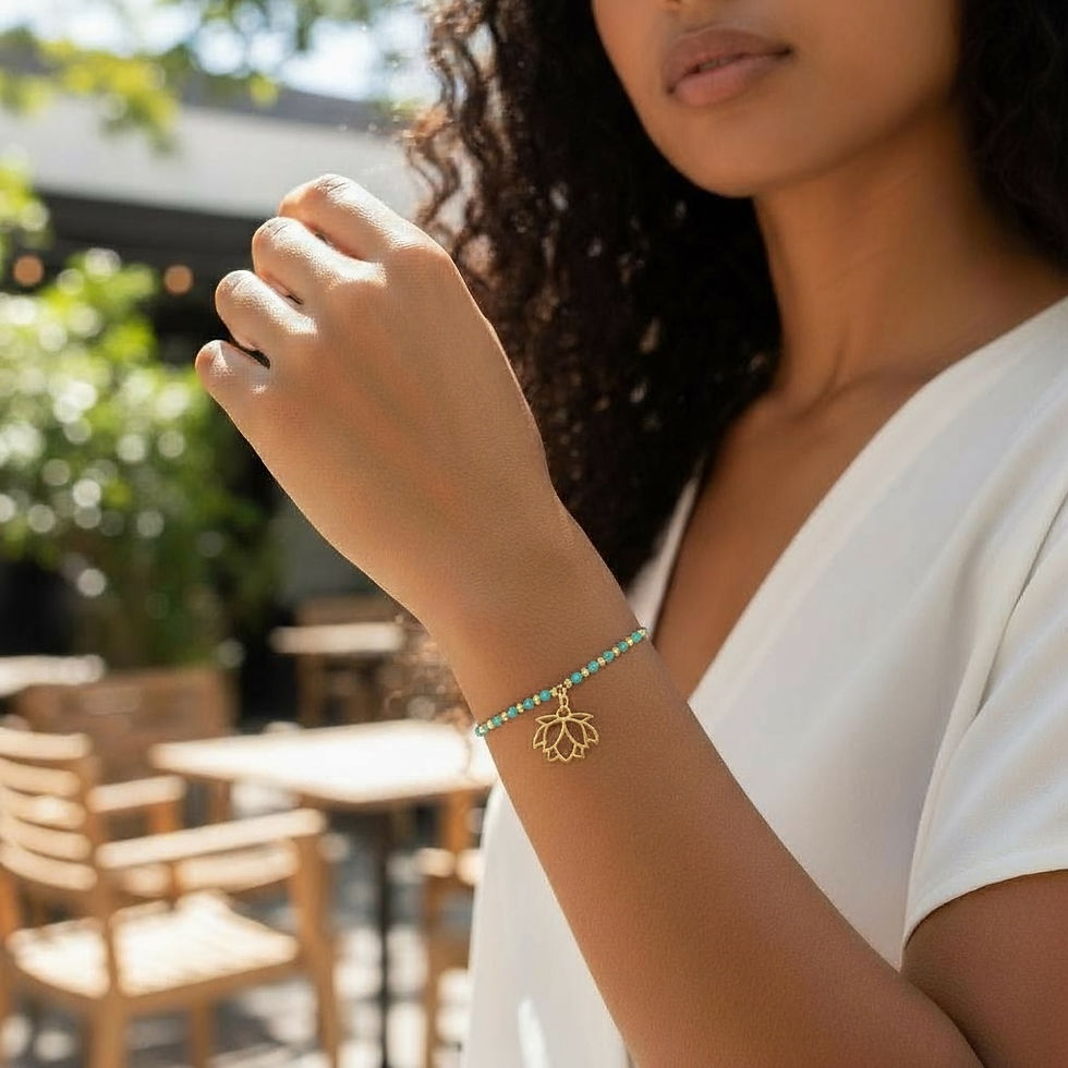 Thumbnail: Model wearing Brass Mojave Turquoise Bracelet with Lotus Charm