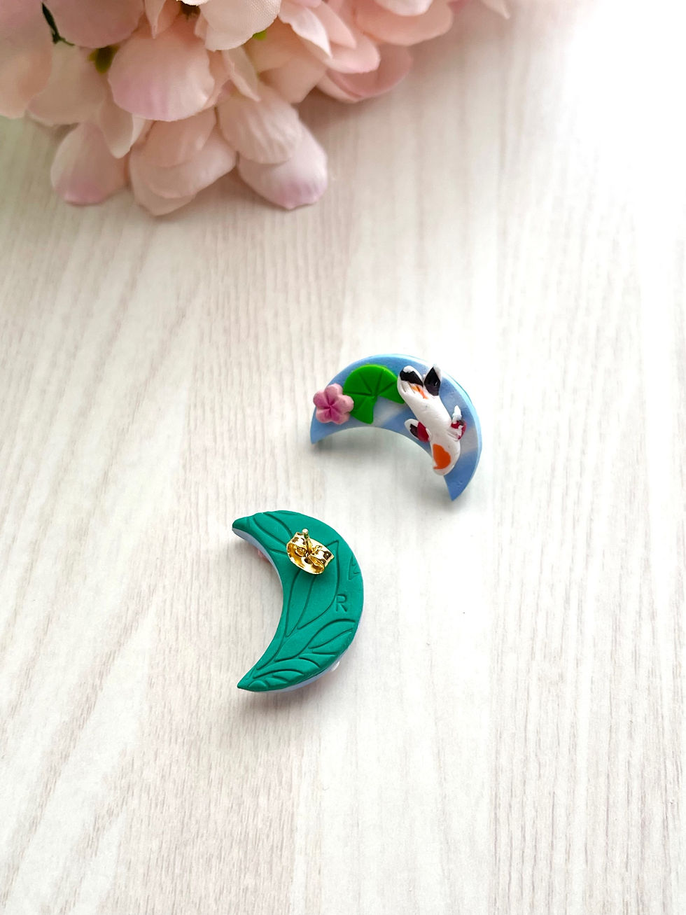 Thumbnail: Crescent koi pond studs  