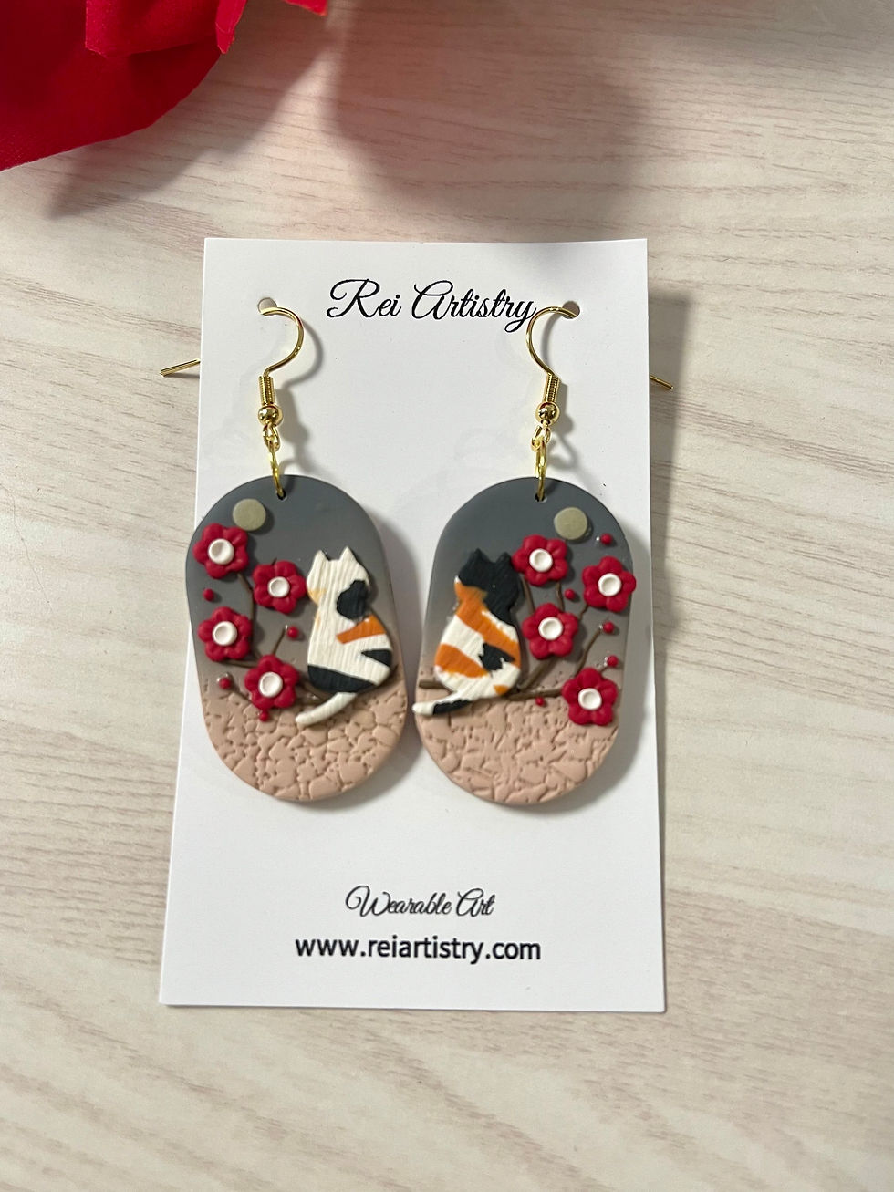 Thumbnail: Cat and plum blossom earrings