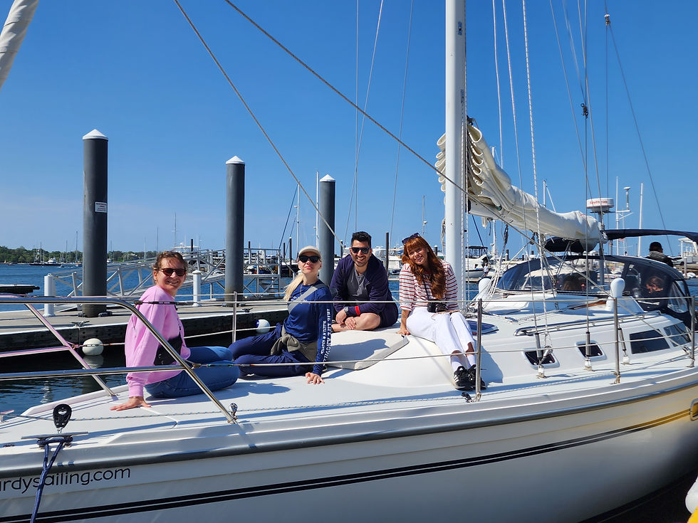 People sitting on bow of boat