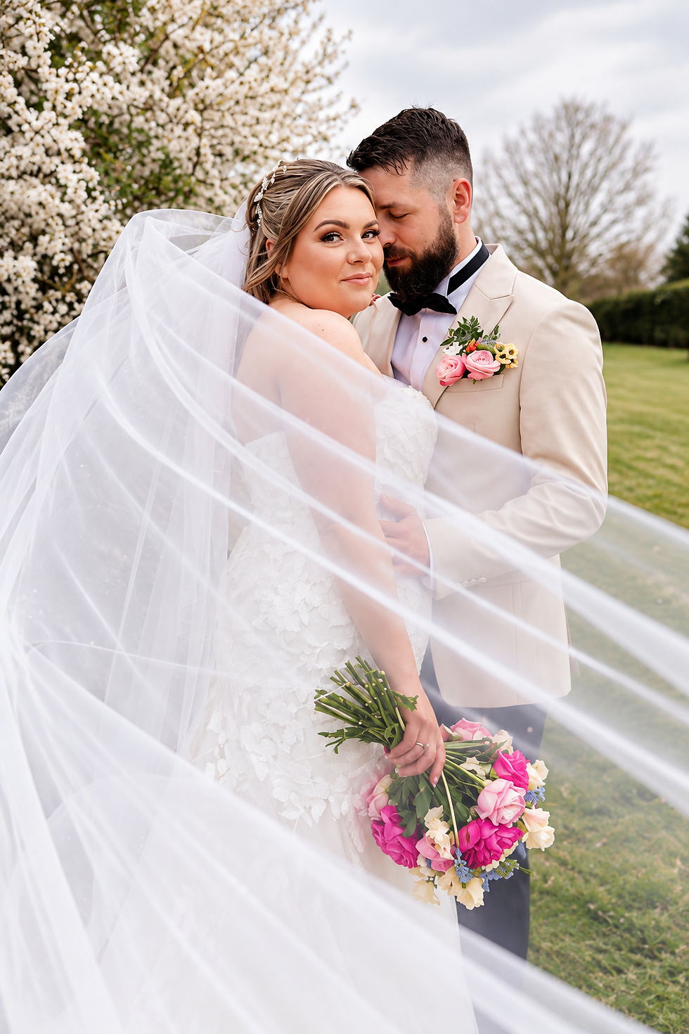 Veil-Swept Garden Wedding Portrait.png