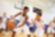 Young basketball players competing on the court during a game