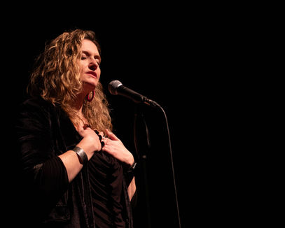 EmmaClaire Brightlyn at the Loud Poets Grand Slam 2024.
Photo credit: Katie Ailes