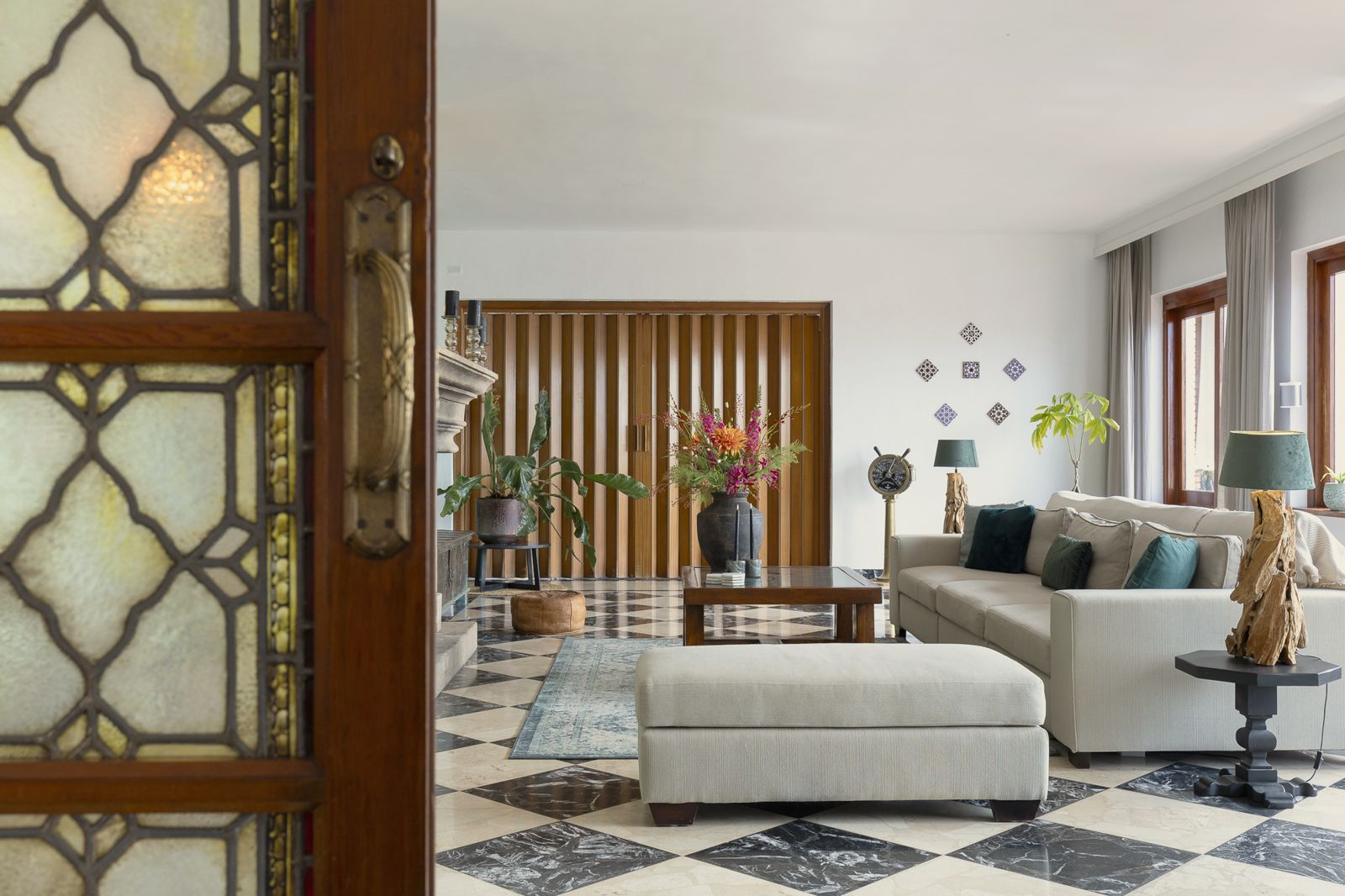 Living room seen through a stained-glass door