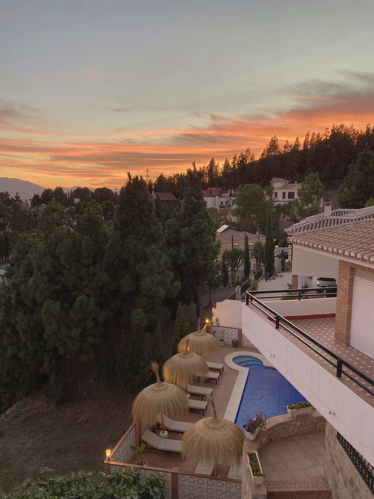 Sunset over the villa and pool