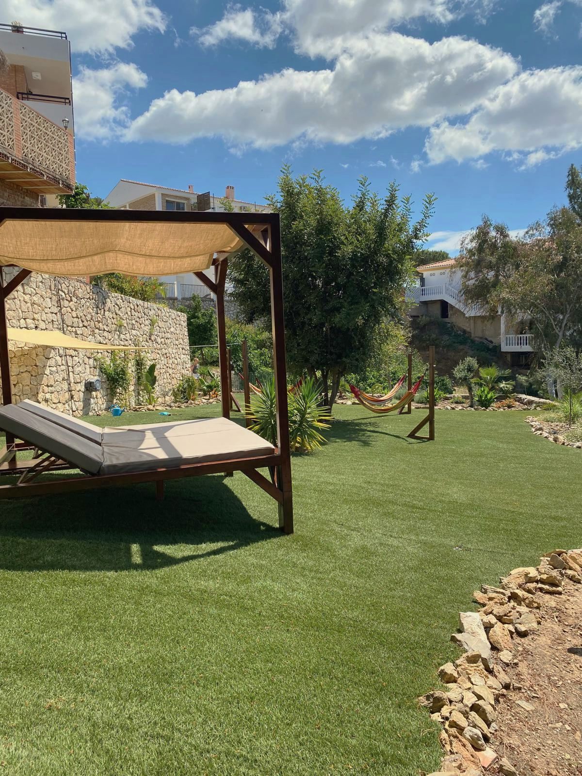 Garden with daybed and hammocks