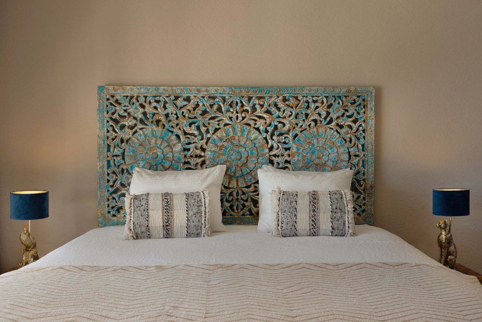 Musa Suite: hand-carved turquoise headboard