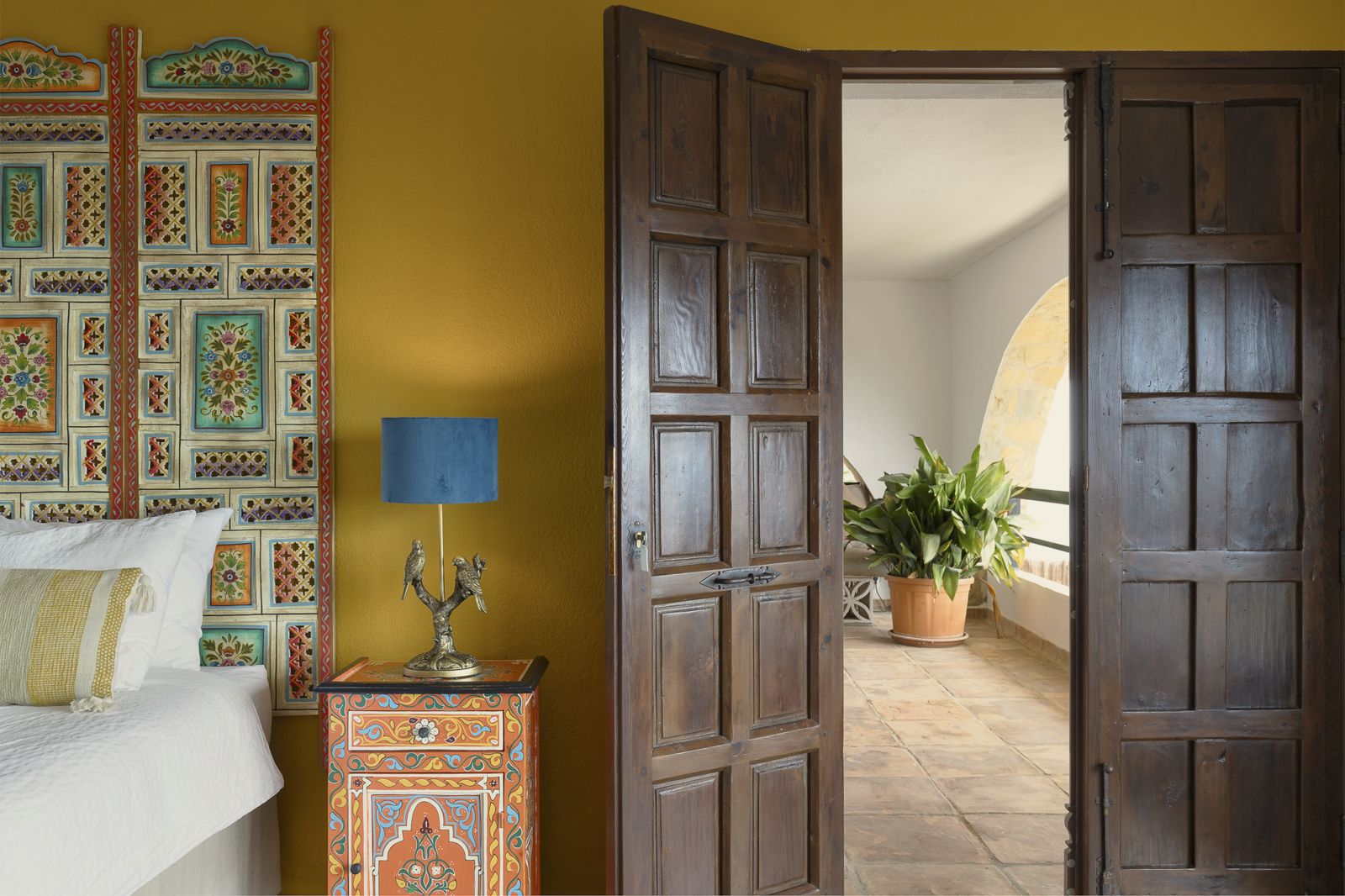 Pilea Suite: bedside and carved doors