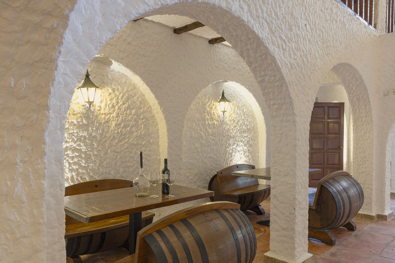 Wine cellar seating under arches