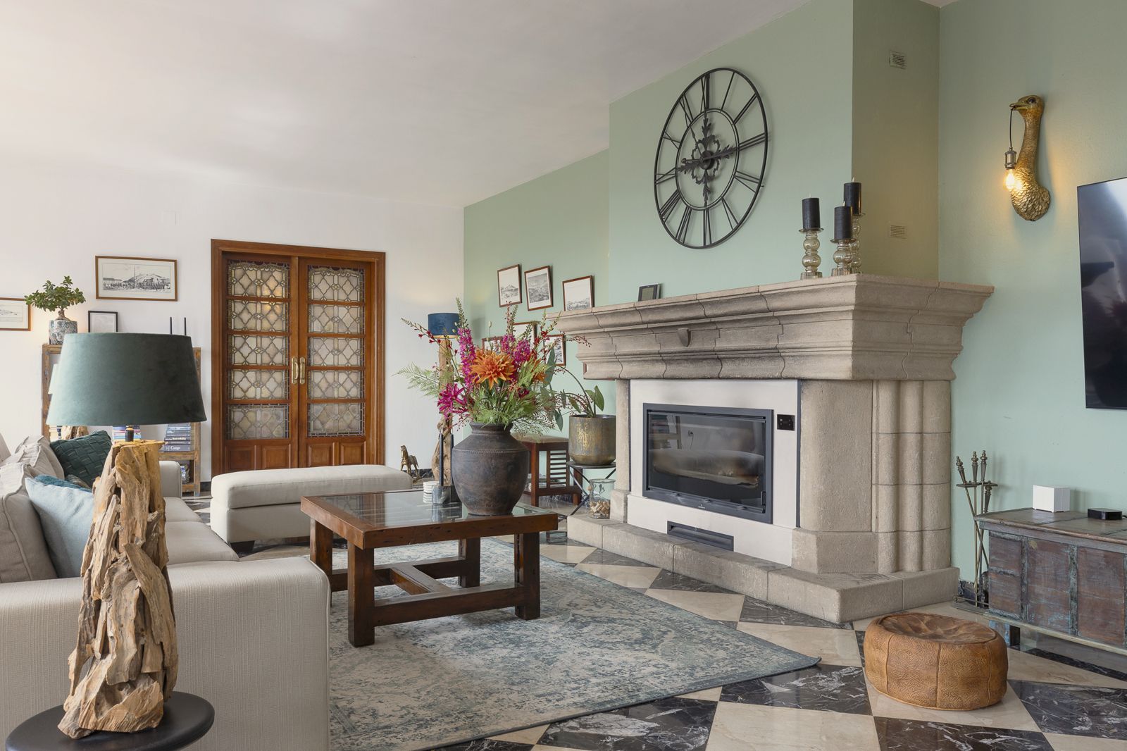 Living room with fireplace and garden doors