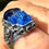 Thumbnail: Siberian Blue Skull Ring: Sterling Silver Infinity Knot symbol