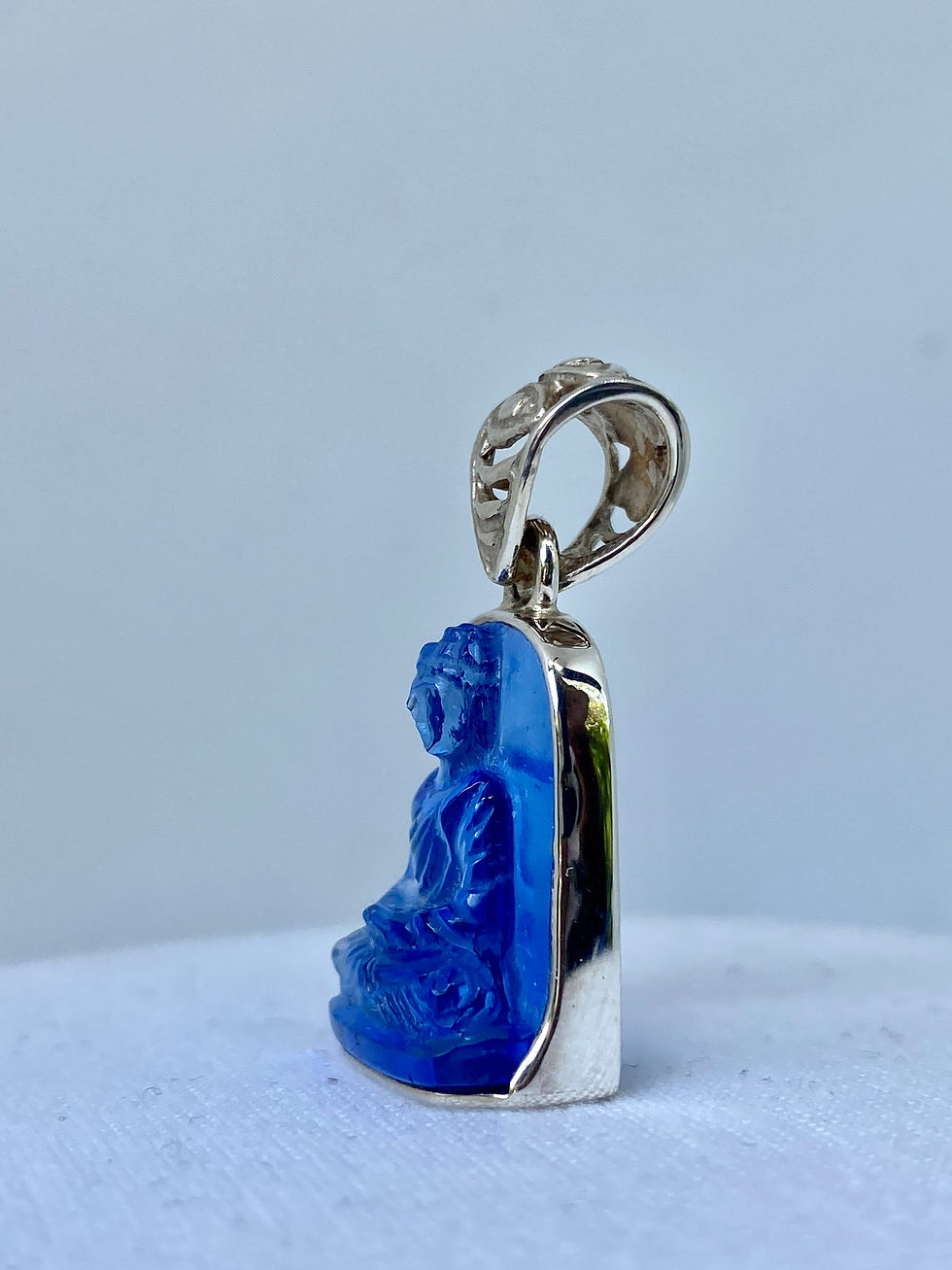 Thumbnail: Hand Carved Siberian Blue Crystal Buddha Pendant: Sterling Silver Amulet