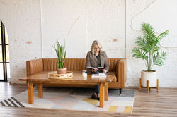 Woman reading on couch, branding and headshot session