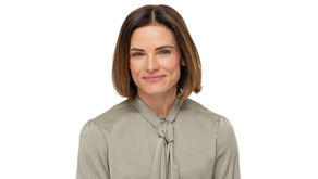 Smiling woman with short brown hair wearing a grey blouse against a white background. Neutral expression, poised and professional. Headshot by Makana Photography, A pinehurst and Southern Pines and Aberdeen based commercial photography studio