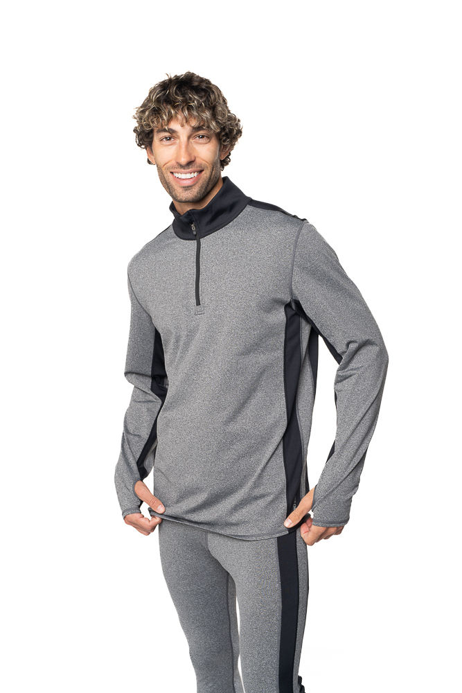 Smiling person in gray athletic wear with black accents, standing against a white background. Relaxed and happy mood.Apparel photoshoot in Pinehurst, Aberdeen and Southern Pines product photography studio