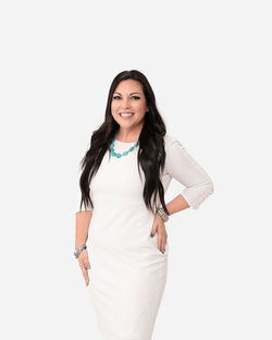 woman in white dress, long black hair, posing on white seamless for Southern Pines headshot