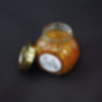 A jar of La Sazon's vibrant Aji Criollo, a Colombian spicy sauce, with a gold lid.