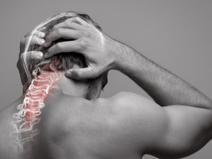 Man holding head and neck, showing spine in pain with red highlight. Gray background, focus on discomfort and tension.