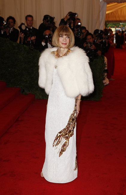 Anna Wintour paying tribute to Schiaparelli in a Prada lobster-motif dress for the 2012 Met Gala, where the "Schiaparelli and Prada: Impossible Conversations" exhibition kicked off