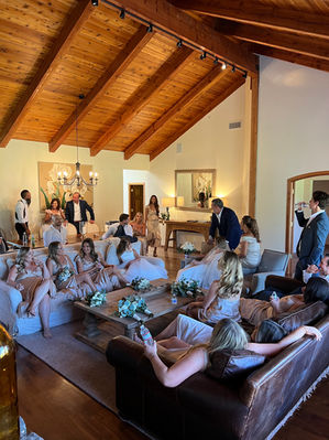 The wedding party gathers before the ceremony in the great room